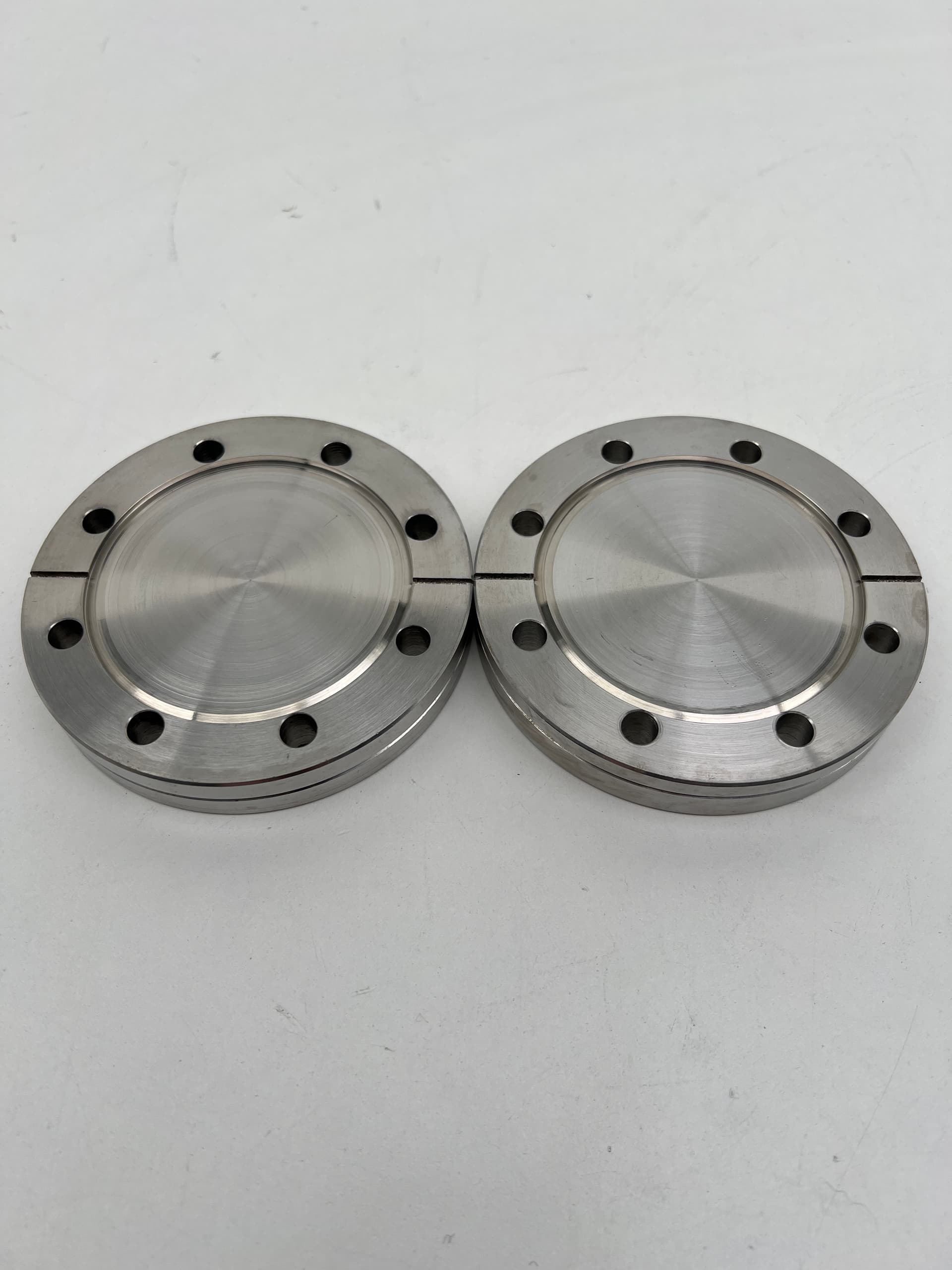 Varian DN63CF 4.50" OD UHV Vacuum Fixed Through Hole Blank 304SS- Lot of 2